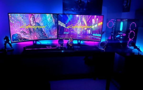 A gamer's PC set up in the style of Cyberpunk 2077