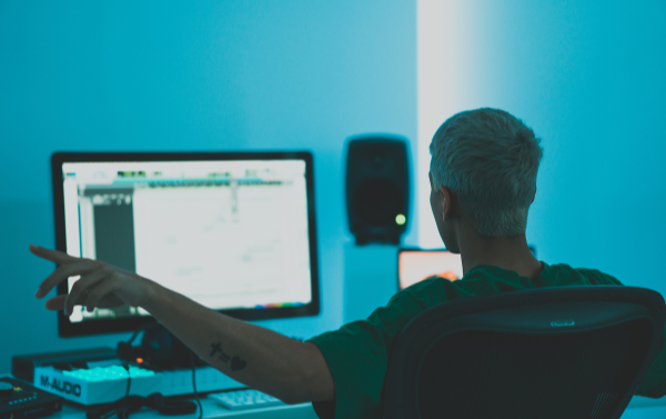 a music producer working in front of their custom built pc